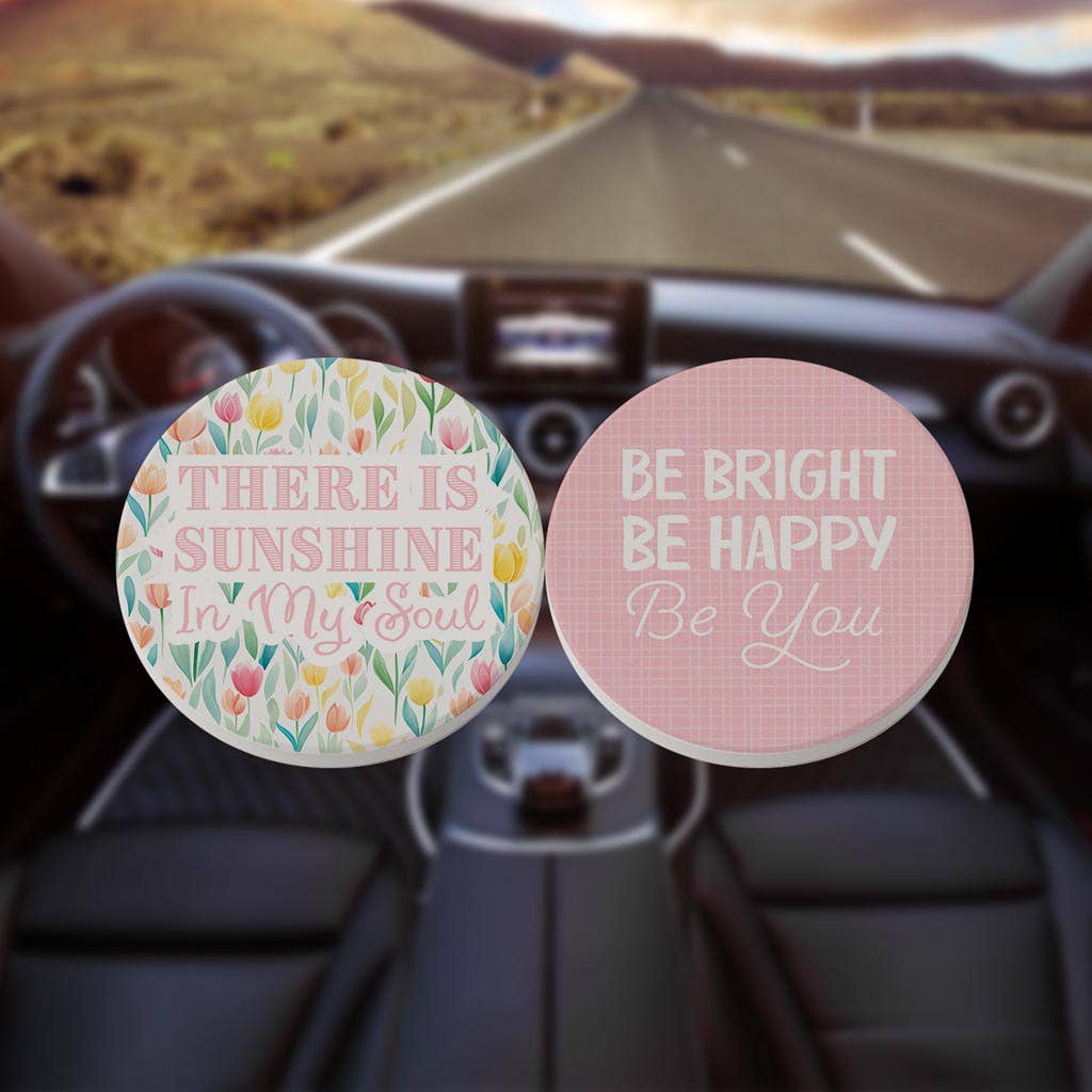 2-pack car coasters with one saying "there is sunshine in my soul" and "be bright, be happy, be you".