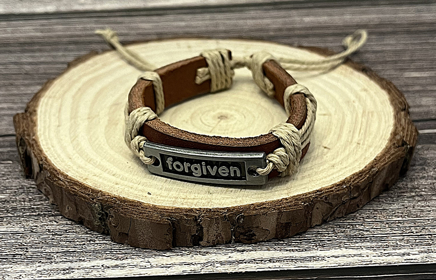 Adjustable leather Christian bracelet with metal tag engraved Forgiven inspirational faith jewelry