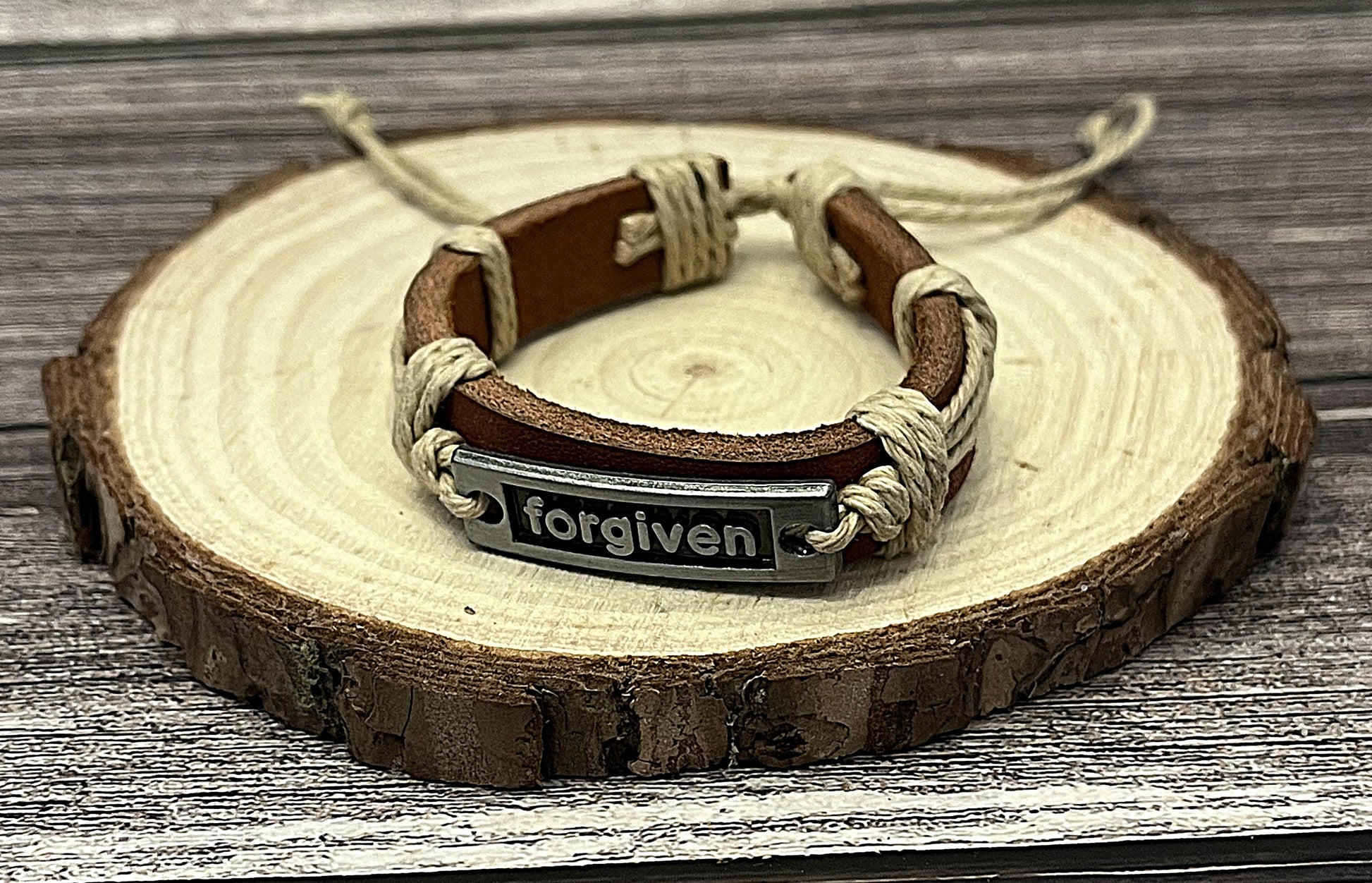 Adjustable leather Christian bracelet with metal tag engraved Forgiven inspirational faith jewelry