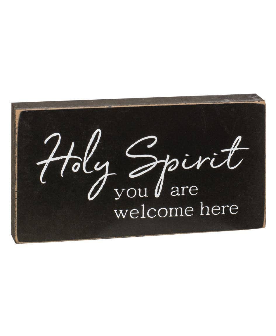 Holy Spirit you are welcome here black distressed wooden sign.