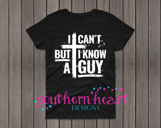 Black men’s t-shirt with white screen-printed text that reads “I can’t but I know a guy” alongside a cross, made of Gildan heavy cotton 50/50 fabric.
