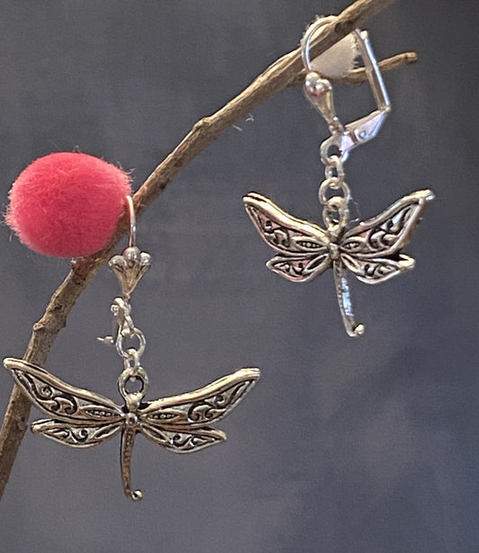 Silver-toned dragonfly earrings in post and lever back styles, each approximately 1½ inches long.