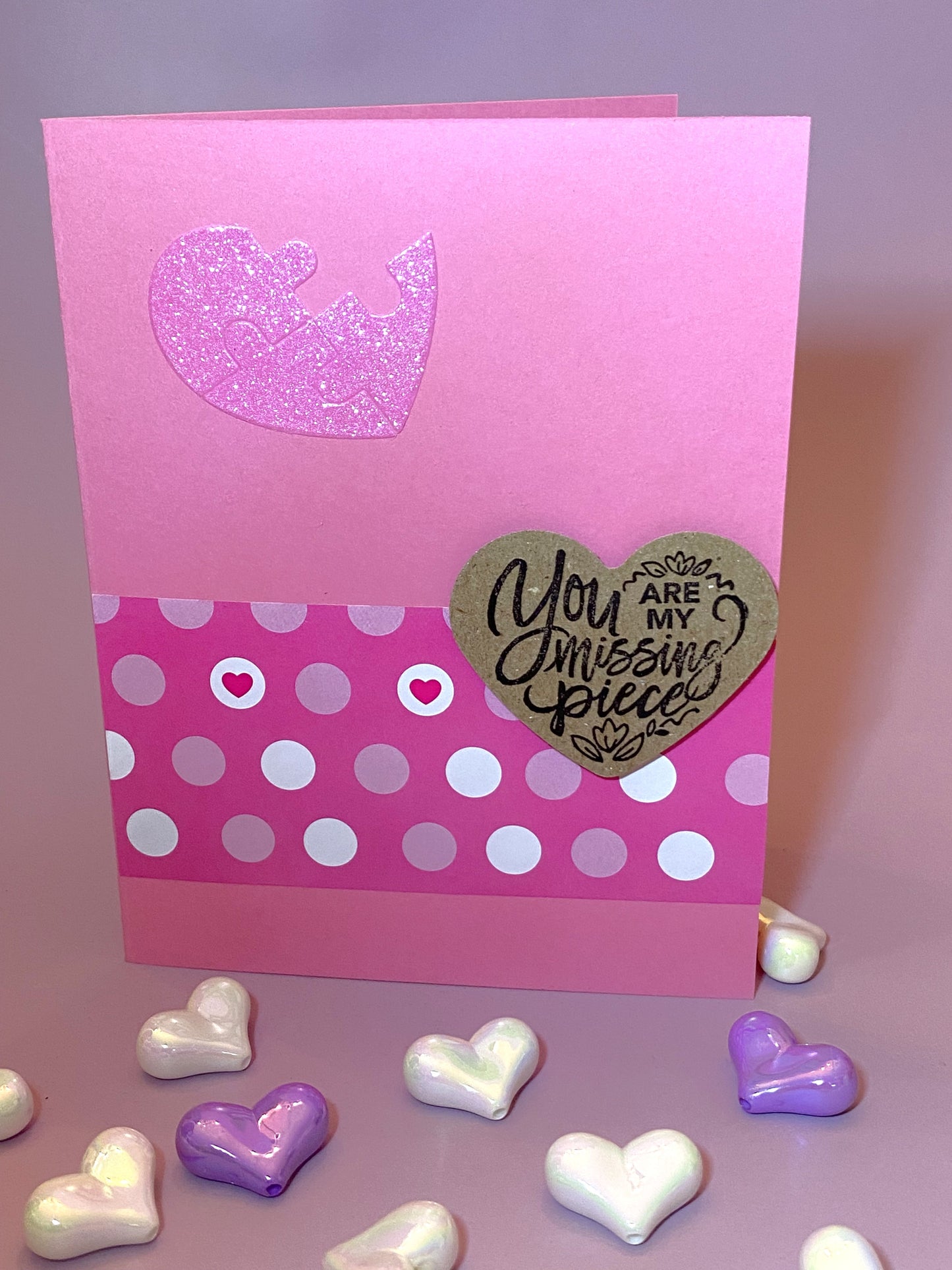 Pink card with heart design and 'You are my missing piece' message.