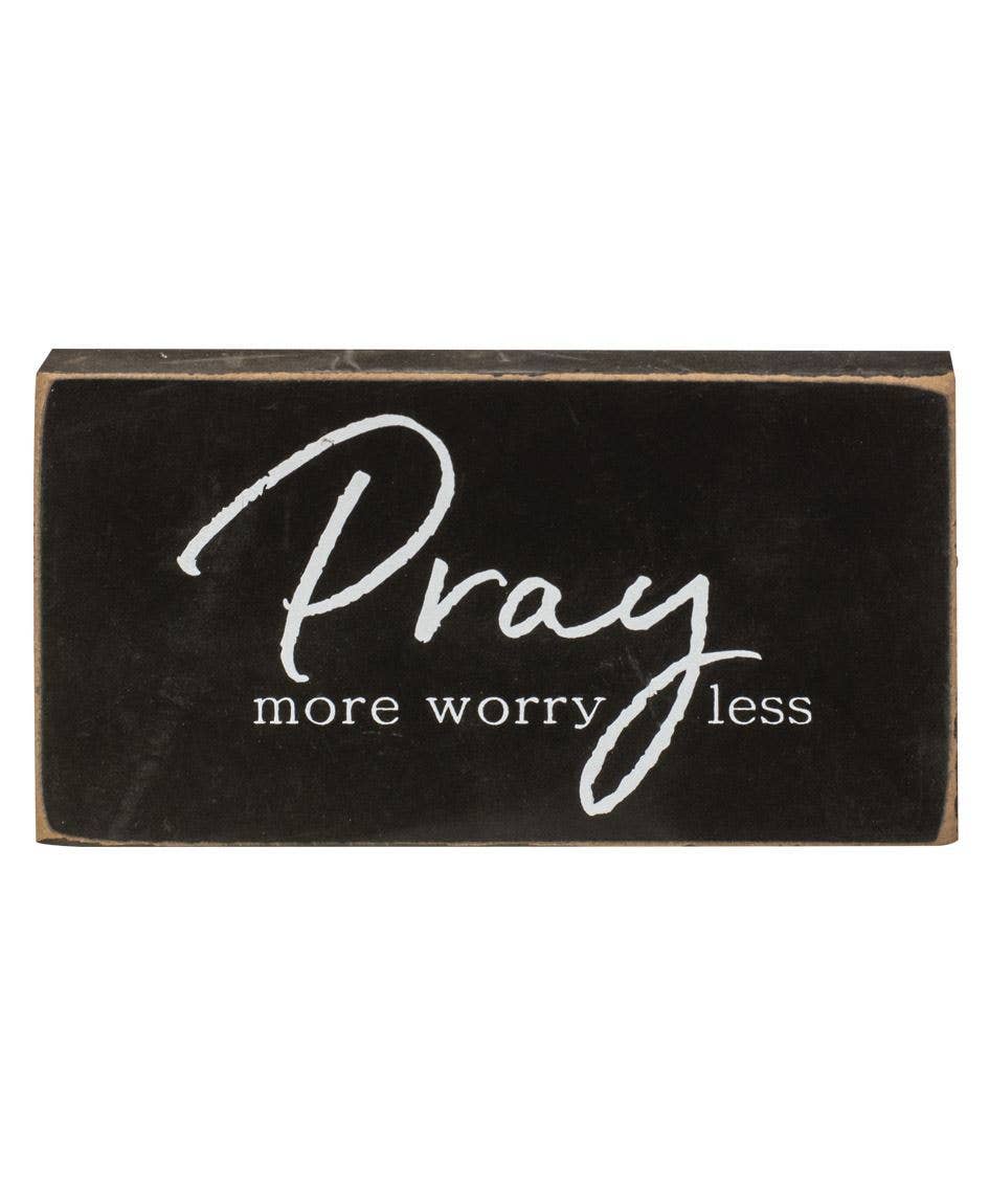Pray more worry less black distressed wooden blocks.