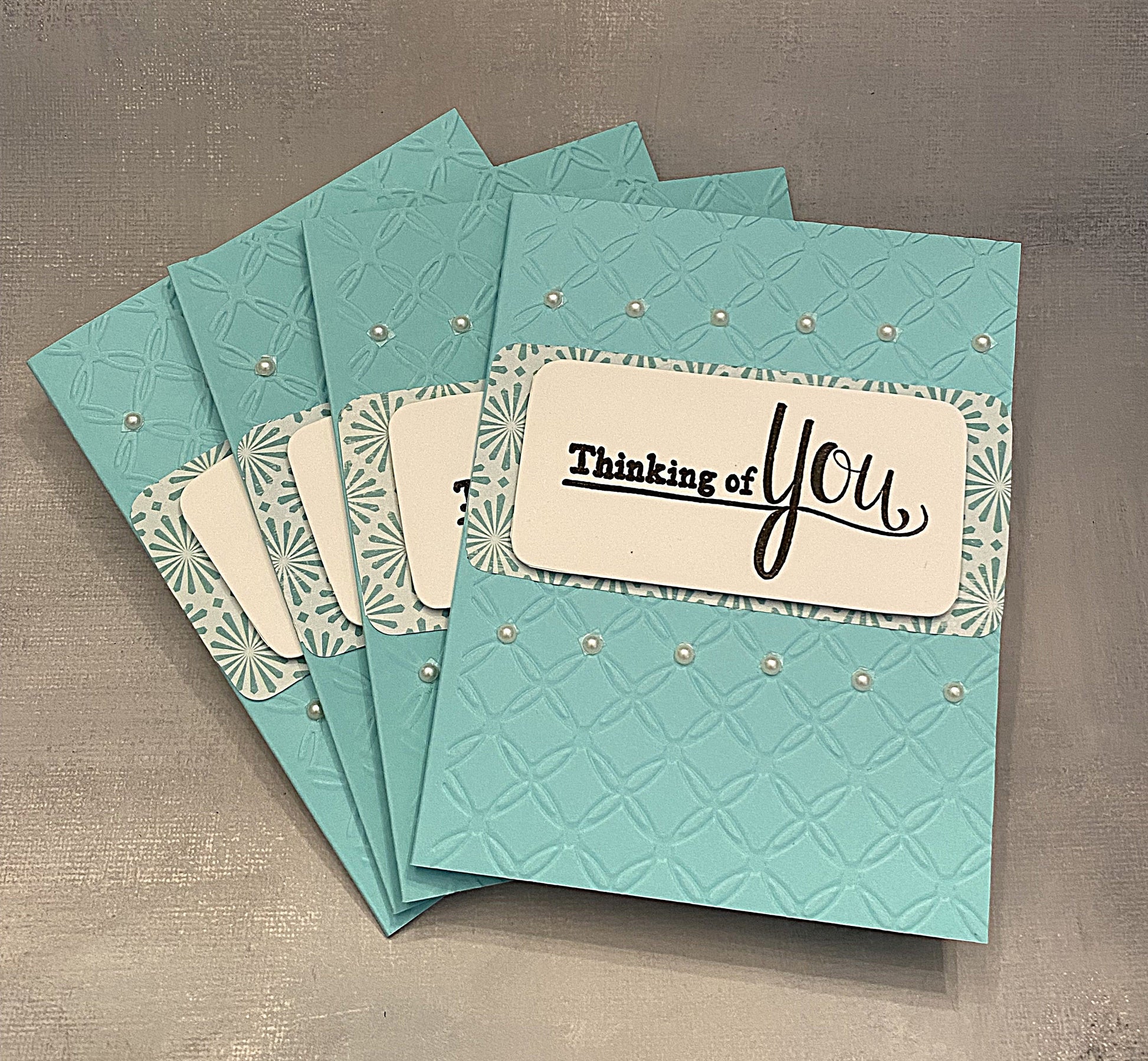Set of 4 light blue “Thinking of You” note cards (4¼" x 5½") with pearl accents. Blank inside with matching envelopes. Elegant and perfect for heartfelt notes.