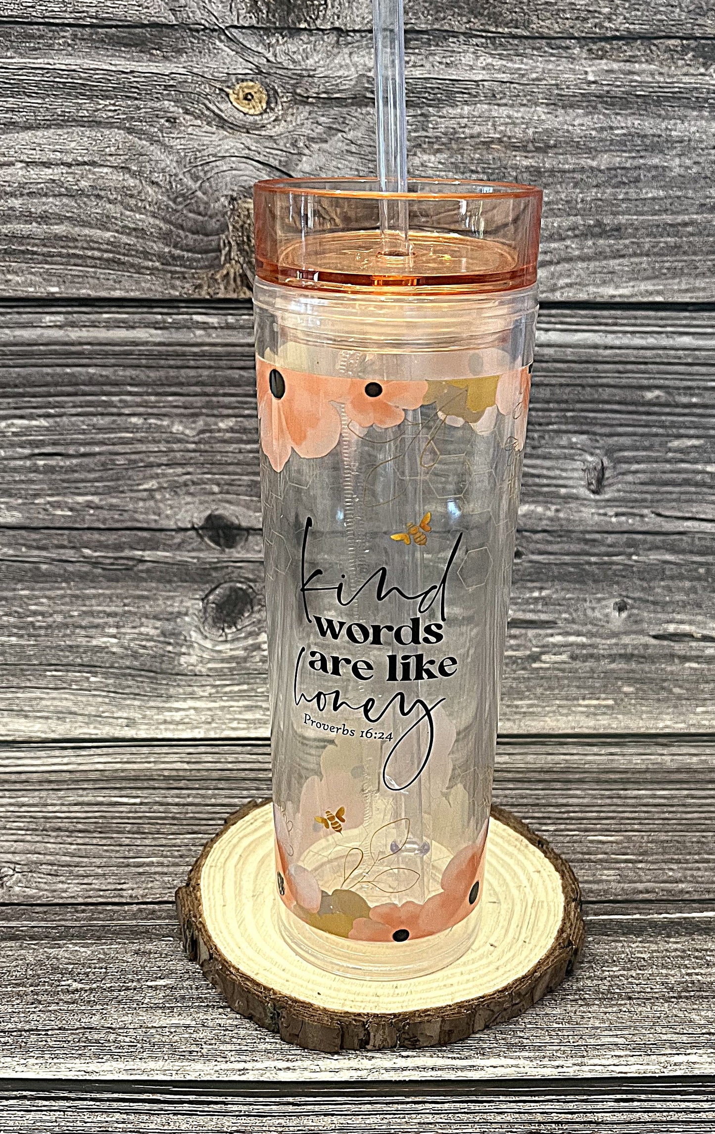 Christian tumbler with peach lid and straw featuring bees, flowers, and Kind Words Are Like Honey Proverbs 16:24 KJV