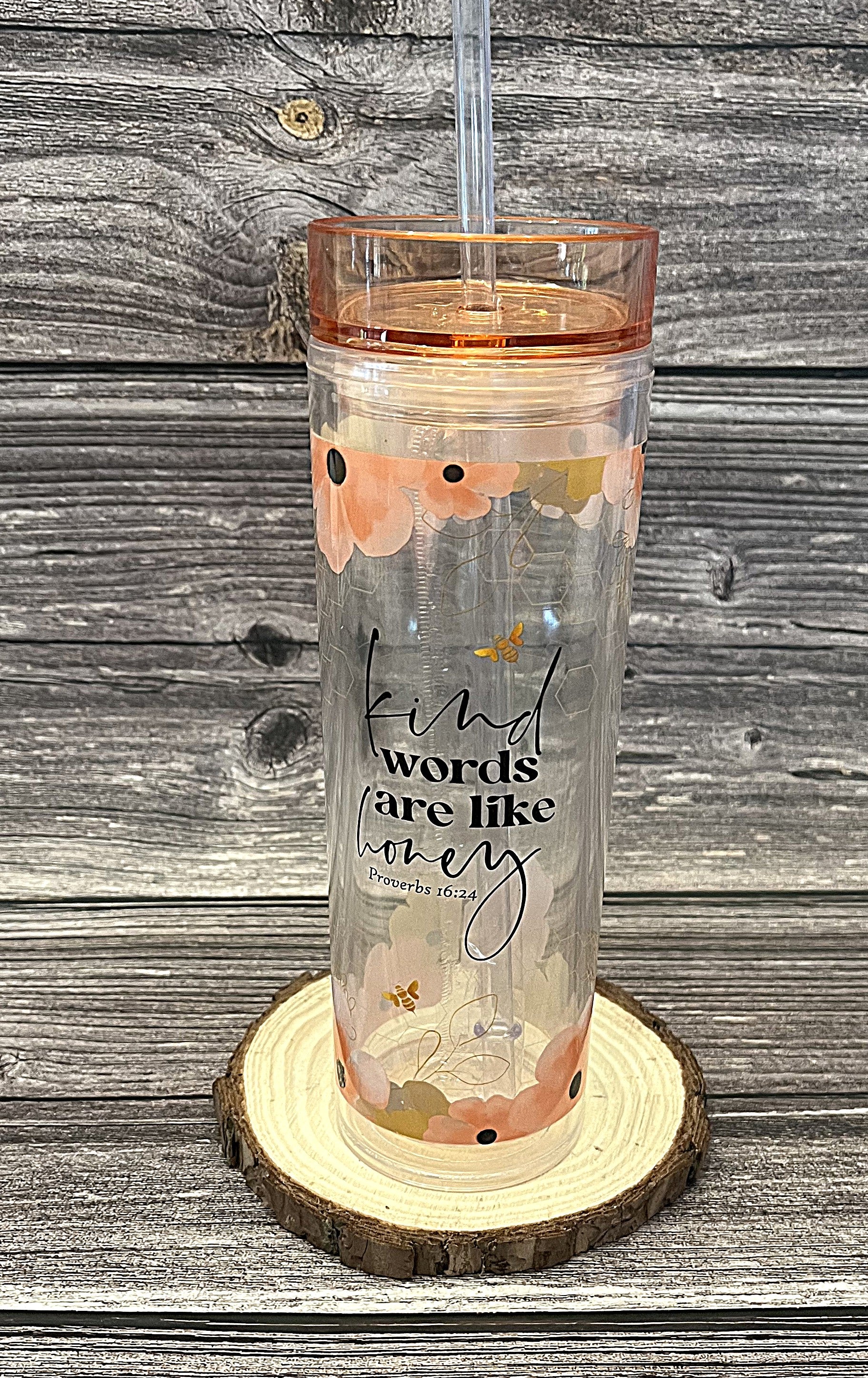 Christian tumbler with peach lid and straw featuring bees, flowers, and Kind Words Are Like Honey Proverbs 16:24 KJV