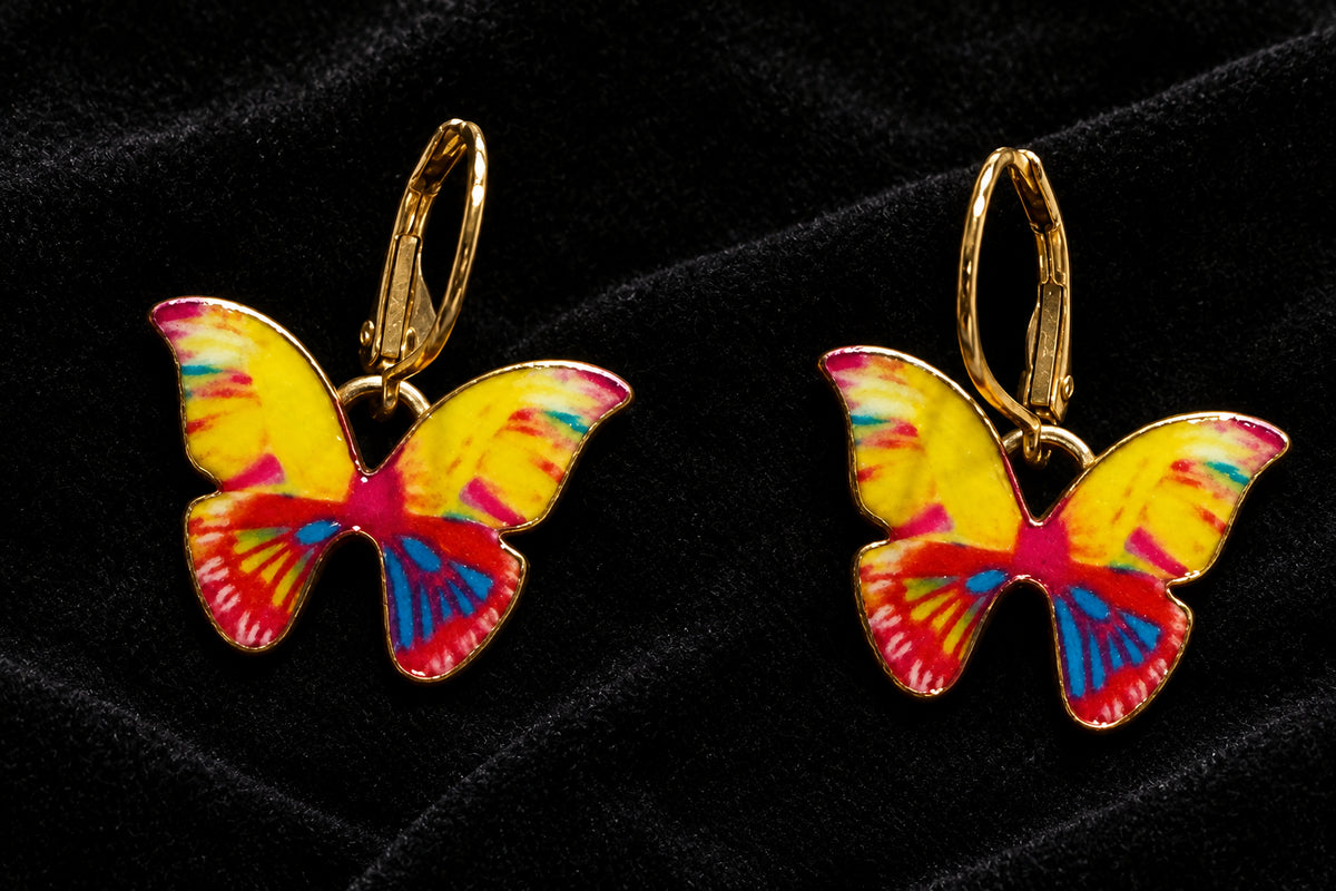 Yellow butterfly earrings, approximately 1 inch long, with gold-toned interchangeable lever back ear wires.