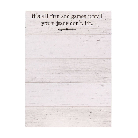 Mini notepad with 50 sheets (5.5" x 4") featuring a shiplap design and the phrase “It’s all fun and games until your jeans don’t fit,” with optional magnet.